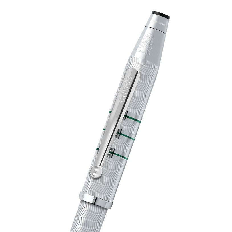 Silver pen with intricate design on a white background